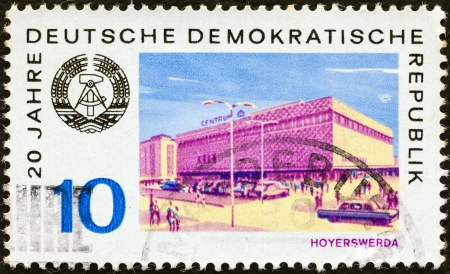 GERMAN DEMOCRATIC REPUBLIC - CIRCA 1969: A stamp printed in Germany from the "20th anniversary of German Democratic Republic" 1st issue shows Hoyerswerda city, circa 1969. のeditorial素材