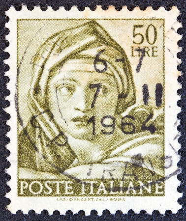 ITALY - CIRCA 1961: A stamp printed in Italy from the "Michelangelo" issue shows the head of Delphic Sibyl from Sistine Chapel, circa 1961. のeditorial素材