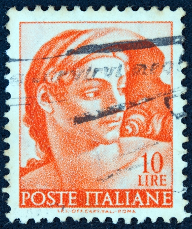ITALY - CIRCA 1961: A stamp printed in Italy from the "Michelangelo" issue shows a head of the "Ignudi" from Sistine Chapel, circa 1961. のeditorial素材