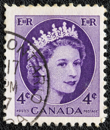 CANADA - CIRCA 1954: A stamp printed in Canada shows a portrait of Queen Elizabeth II, circa 1954. のeditorial素材