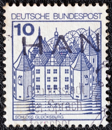 GERMANY - CIRCA 1977: A stamp printed in Germany from the "Strongholds and castles" issue shows Glucksburg castle, circa 1977. のeditorial素材