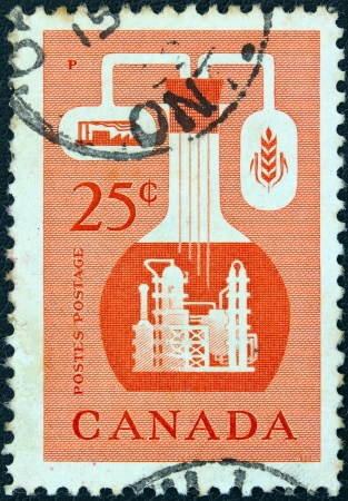 CANADA - CIRCA 1956: A stamp printed in Canada issued to emphasize the importance of the chemical industry in the economy of Canada, circa 1956. のeditorial素材
