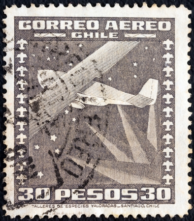 CHILE - CIRCA 1934: A stamp printed in Chile shows stylized Dornier Wal flying boat and compass, circa 1934. のeditorial素材