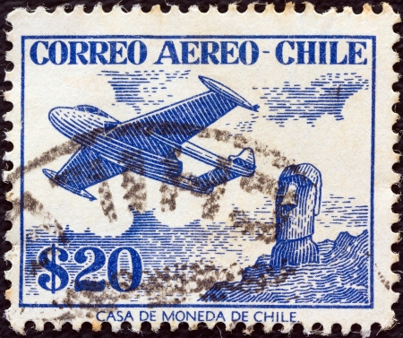 CHILE - CIRCA 1956: A stamp printed in Chile shows De Havilland Venom FB.4 and Easter Island monolith, circa 1956. のeditorial素材