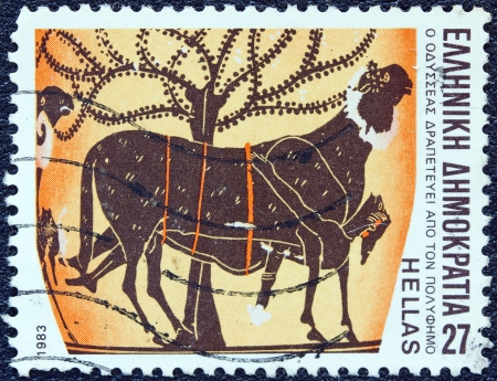 GREECE - CIRCA 1983: A stamp printed in Greece from the "Homeric epics" issue shows Odysseus escaping from Polyphemus's cave, circa 1983. のeditorial素材