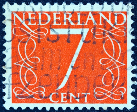 NETHERLANDS - CIRCA 1946: A stamp printed in the Netherlands shows it's value of 7 cent, circa 1946. のeditorial素材