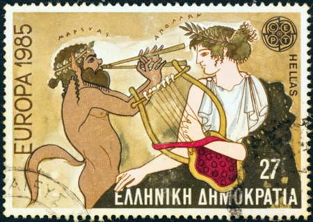 GREECE - CIRCA 1985: A stamp printed in Greece from the "Europa" issue shows musical contest mosaic between Marsyas and Apollo, circa 1985. のeditorial素材