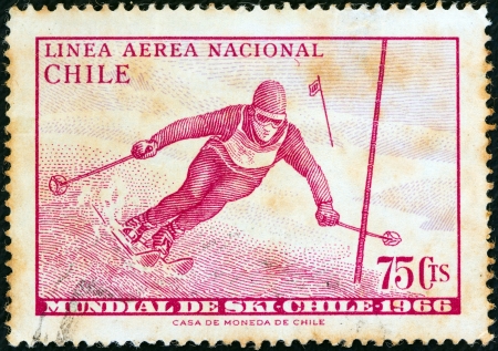 CHILE - CIRCA 1966: A stamp printed in Chile from the "World Skiing Championships - Chile 1966" issue shows Skier in slalom race, circa 1966. のeditorial素材
