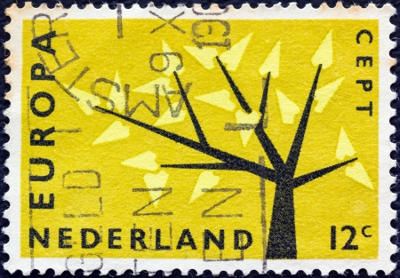 NETHERLANDS - CIRCA 1962: A stamp printed in the Netherlands from the "Europa" issue shows Europa Tree, circa 1962. のeditorial素材