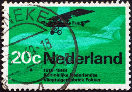 NETHERLANDS - CIRCA 1969: A stamp printed in the Netherlands issued for the 50th anniversary of the founding in 1919 of Royal Dutch Airlines and Fokker factories shows Fokker F.2, circa 1969. のeditorial素材