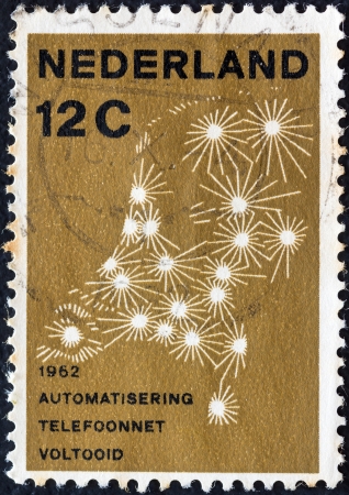 NETHERLANDS - CIRCA 1962: A stamp printed in the Netherlands issued for the completion of Netherlands Automatic Telephone System shows diagram of telephone network, circa 1962. のeditorial素材