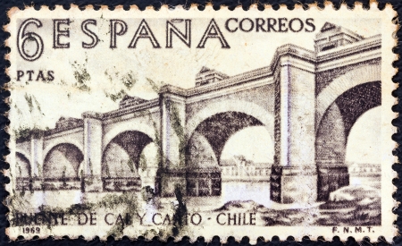 SPAIN - CIRCA 1969: A stamp printed in Spain from the "Explorers and Colonizers of America (9th series)" issue shows Cal y Canto Bridge, Chile, circa 1969. のeditorial素材