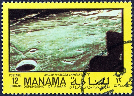 MANAMA DEPENDENCY - CIRCA 1970: A stamp printed in United Arab Emirates from the "Space exploration" issue shows location of the moon landing, circa 1970. のeditorial素材