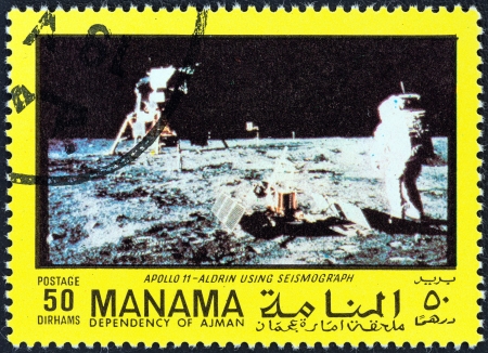 MANAMA DEPENDENCY - CIRCA 1970: A stamp printed in United Arab Emirates from the "Space exploration" issue shows Aldrin and seismograph, circa 1970. のeditorial素材