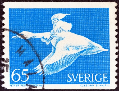 SWEDEN - CIRCA 1971: A stamp printed in Sweden shows Nils Holgersson on goose (from the wonderful adventures of Nils by Selma Lagerlof), circa 1971. のeditorial素材