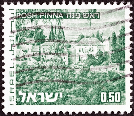 ISRAEL - CIRCA 1971: A stamp printed in Israel from the \"Landscapes\" issue shows Rosh Pinna town, circa 1971. のeditorial素材