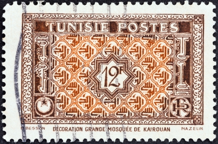 TUNISIA - CIRCA 1947: A stamp printed in Tunisia shows Arabesque Ornamentation from Great Mosque at Kairouan , circa 1947. のeditorial素材