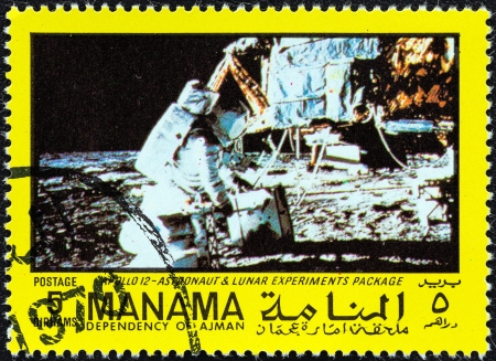 MANAMA DEPENDENCY - CIRCA 1970  A stamp printed in United Arab Emirates from the  Space exploration  issue shows Apollo 12, Astronaut and lunar experiments package, circa 1970  のeditorial素材