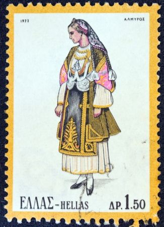 GREECE - CIRCA 1973  A stamp printed in Greece from the  Traditional Greek Costumes 2nd part  issue shows a woman from Almyros, Thessaly, circa 1973  のeditorial素材