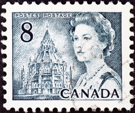 CANADA - CIRCA 1967  A stamp printed in Canada shows Queen Elizabeth II and Library of Parliament, circa 1967  のeditorial素材