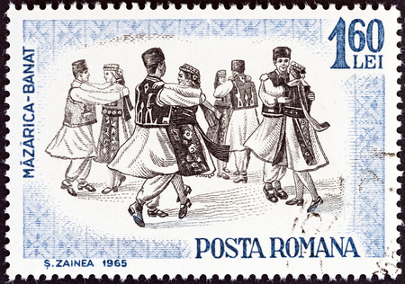 ROMANIA - CIRCA 1965  A stamp printed in Romania from the  Romanian folk dancing  issue shows Banat, circa 1965 のeditorial素材