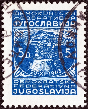 YUGOSLAVIA - CIRCA 1945  A stamp printed in Yugoslavia shows town of Jajce and inscription 29-XI-1943, circa 1945  のeditorial素材