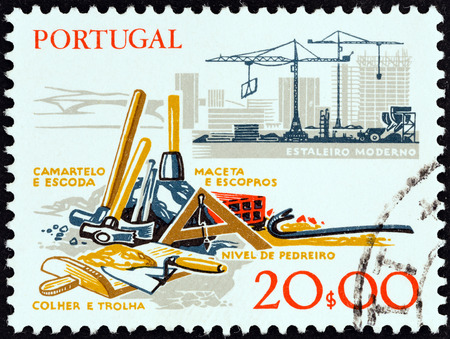 PORTUGAL - CIRCA 1978  A stamp printed in Portugal from the  Development of Working Tools   issue shows hand tools and building sit, circa 1978 のeditorial素材