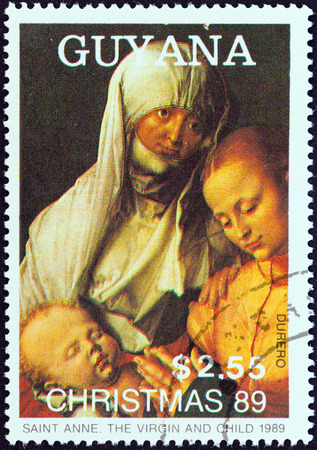 GUYANA - CIRCA 1989  A stamp printed in Guyana from the  Christmas  Paintings  issue shows Saint Anne, The Virgin and Child  Albrecht Durer , circa 1989  のeditorial素材