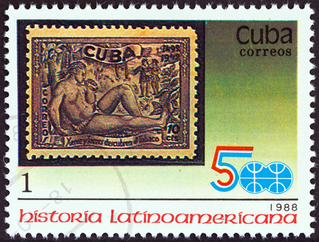 CUBA - CIRCA 1988  A stamp printed in Cuba from the  Latin American History  3rd series   issue shows 1944 10c  Discovery of Tobacco stamp, circa 1988  のeditorial素材