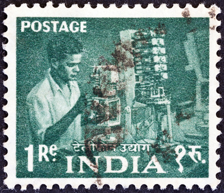 INDIA - CIRCA 1955  A stamp printed in India from the  Five Year Plan  issue shows a telephone engineer, circa 1955  のeditorial素材
