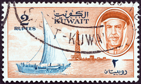 KUWAIT - CIRCA 1959: A stamp printed in Kuwait shows Sheikh Abdullah, dhow and oil derrick, circa 1959. のeditorial素材