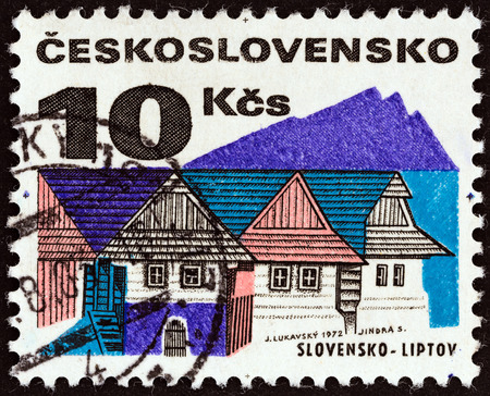 CZECHOSLOVAKIA - CIRCA 1972: A stamp printed in Czechoslovakia from the \"Regional Buildings\" issue shows Wooden houses, Liptov, circa 1972.のeditorial素材