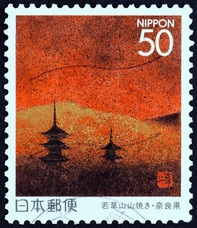 JAPAN - CIRCA 1996: A stamp printed in Japan from the \"Prefectural Stamps - Nara \" issue shows grass-burning rite on Mt Wakarusa, circa 1996.のeditorial素材