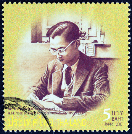 THAILAND - CIRCA 2007: A stamp printed in Thailand from the \"80th anniversary of the Birth of H.M. The King \" issue shows Thai King Bhumibol Adulyadej photograph in young age, circa 2007.のeditorial素材