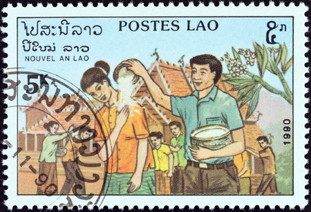 LAOS - CIRCA 1990: A stamp printed in Laos from the \\\\\\\"New Year\\\\\\\" issue shows Rice Ceremony, circa 1990.のeditorial素材