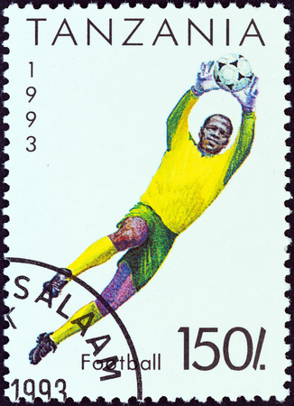 TANZANIA - CIRCA 1993: A stamp printed in Tanzania shows a football goalkeeper, circa 1993.のeditorial素材
