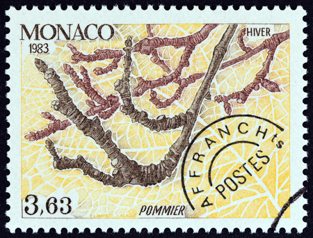 MONACO - CIRCA 1983: A stamp printed in Monaco from the \"The Four Seasons of the Apple Tree \" issue shows Winter, circa 1983.のeditorial素材