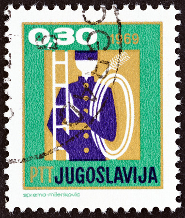 YUGOSLAVIA - CIRCA 1969: A stamp printed in Yugoslavia from the "New Year" issue shows chimney sweep with ladder, circa 1969.のeditorial素材