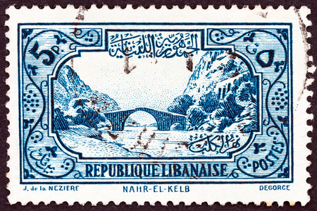 LEBANON - CIRCA 1940: A stamp printed in Lebanon shows Nahr el-Kalb Bridge, circa 1940.のeditorial素材