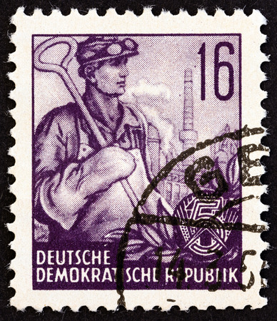 GERMAN DEMOCRATIC REPUBLIC  CIRCA 1953: A stamp printed in Germany from the "Five Year Plan" issue shows Foundry worker circa 1953.のeditorial素材