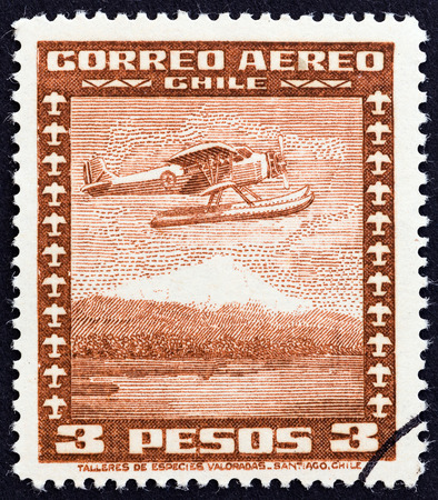 CHILE  CIRCA 1934: A stamp printed in Chile shows Stinson Faucett F.19 seaplane in flight circa 1934.のeditorial素材