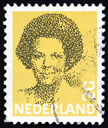 NETHERLANDS - CIRCA 1982: A stamp printed in the Netherlands shows Queen Beatrix, circa 1982.のeditorial素材