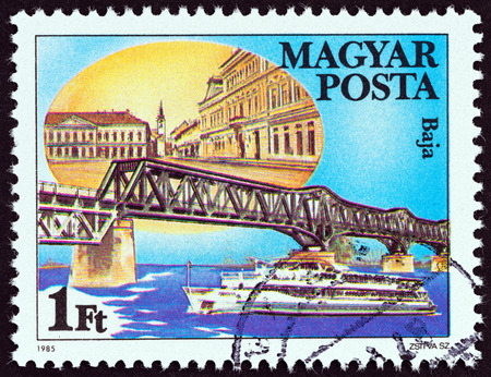 HUNGARY - CIRCA 1985: A stamp printed in Hungary from the "Danube Bridges " issue shows Baja, Hungary, circa 1985.のeditorial素材