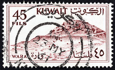 KUWAIT - CIRCA 1961: A stamp printed in Kuwait shows Wara hill, circa 1961.のeditorial素材