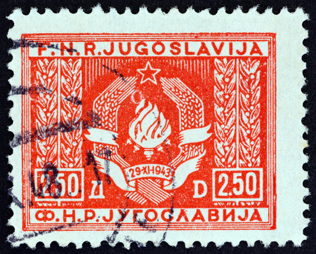 YUGOSLAVIA - CIRCA 1946: A stamp printed in Yugoslavia shows Coat of Arms of Yugoslavia, circa 1946.のeditorial素材