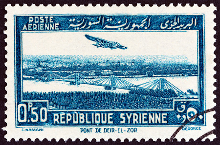 SYRIA - CIRCA 1940: A stamp printed in Syria shows Deir ez-Zor bridge, circa 1940.のeditorial素材