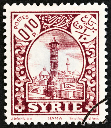 SYRIA - CIRCA 1930: A stamp printed in Syria shows Hama, circa 1930.のeditorial素材