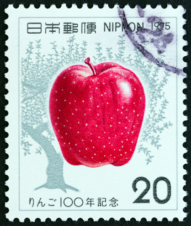 JAPAN - CIRCA 1975: A stamp printed in Japan issued for the centenary of apple cultivation in Japan shows an apple, circa 1975.のeditorial素材