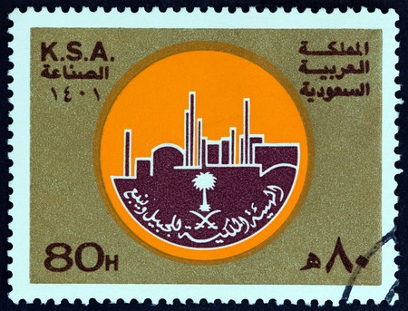 SAUDI ARABIA - CIRCA 1981: A stamp printed in Saudi Arabia from the " Industry Week " issue shows emblem, circa 1981.のeditorial素材