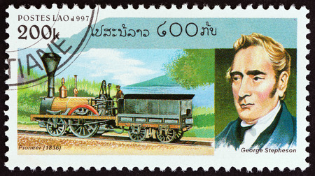 LAOS - CIRCA 1997: A stamp printed in Laos from the Steam Railway Locomotives  issue shows George...